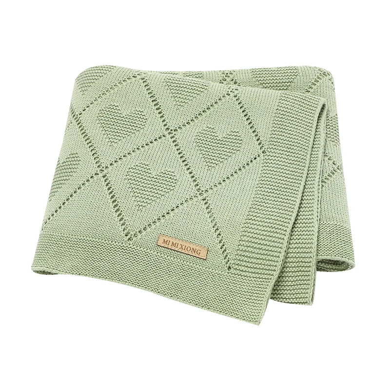 Couverture bébé en tricot verte avec motifs cœur, douce et confortable