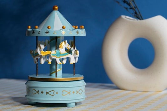 Boite à musique carrousel - Cigogne et bébé