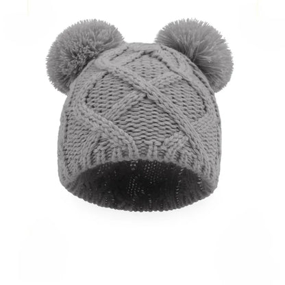 Bonnet bébé gris en tricot avec pompons | Accessoire chaud et doux pour nouveau-né hiver