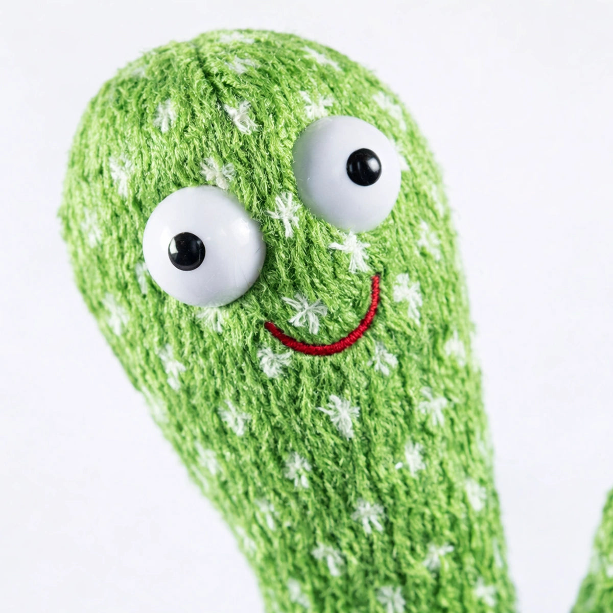 Cactus dansant interactif pour bébé en peluche verte, zoom détail texture douce et visage souriant