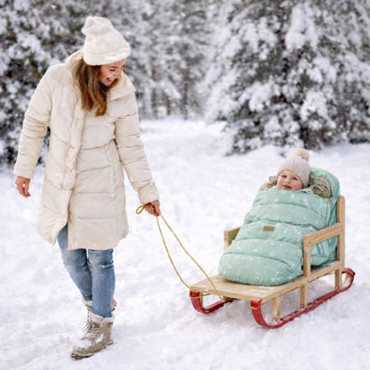 Chancelière bébé hiver utilisée sur traîneau protection contre le froid et la neige
