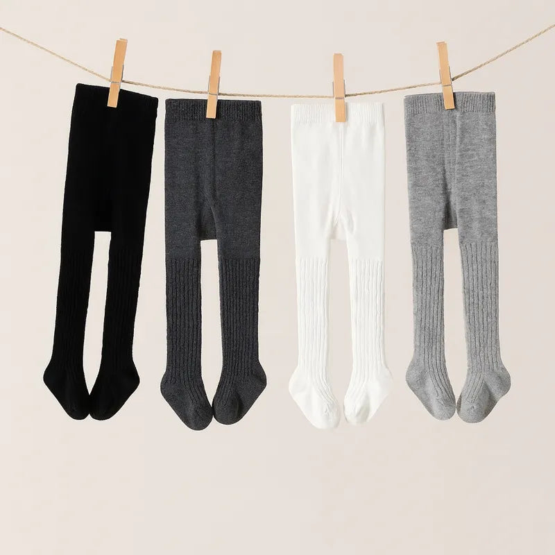 Collants bébé chauds sur corde à linge couleurs noir gris blanc pour toutes saisons