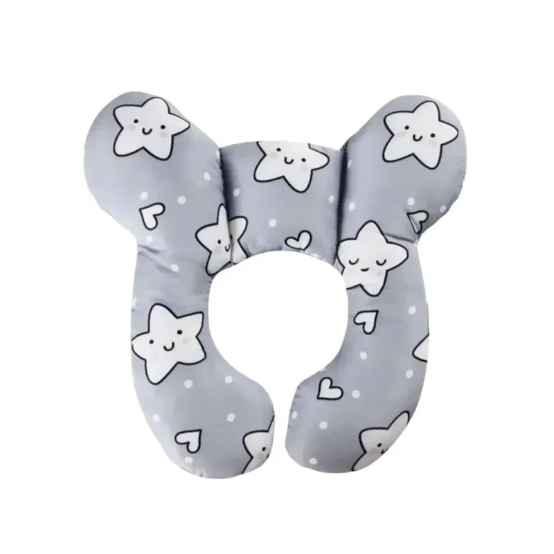 Coussin de voyage bébé motif étoiles souriantes grises