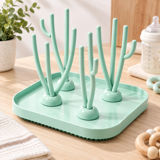 Égouttoir à biberons pour bébé vert menthe avec branches de séchage sur plateau