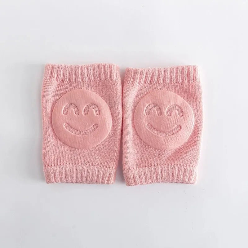 Genouillère bébé rose antidérapante avec sourire pour apprentissage marche
