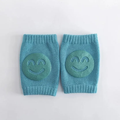 Genouillère bébé bleue antidérapante avec motif sourire pour premiers pas