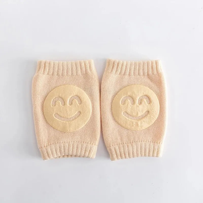 Genouillère bébé beige antidérapante sourire offrant confort et sécurité