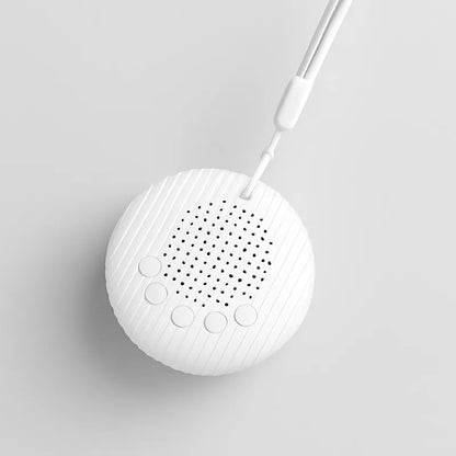 Machine à bruit blanc portable avec fond gris doux