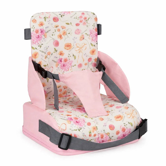 Rehausseur de chaise bébé portable motif fleurs rose avec harnais de sécurité sur fond blanc