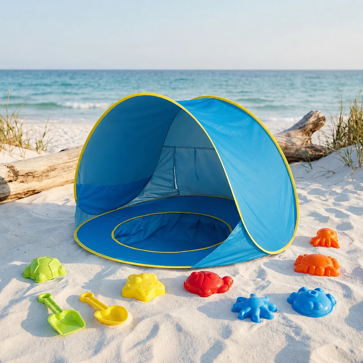 Tente anti-UV bébé UPF50+ bleue avec piscine intégrée pour jouer à la plage en toute sécurité.